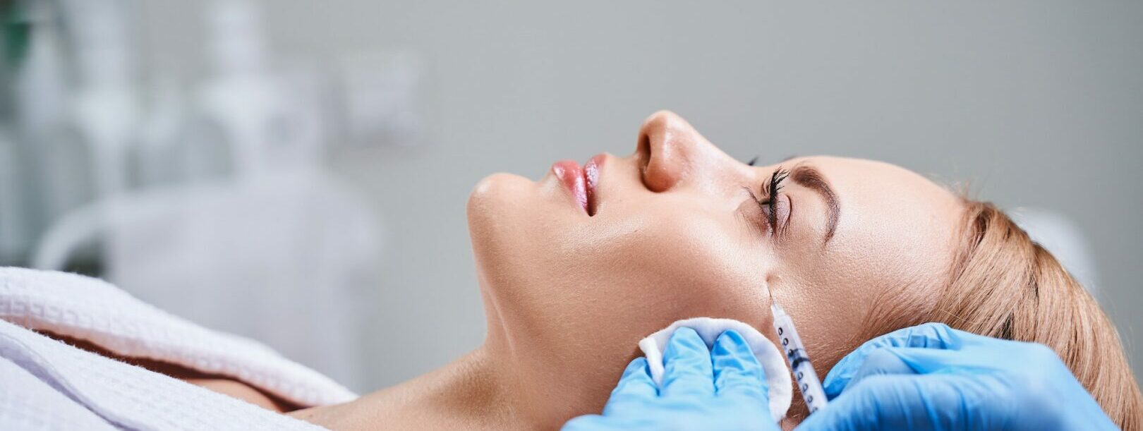 Female is receiving botox injections stock photo